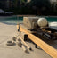 Pilates reformer machine on a patio with outdoor setting